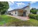 Backyard featuring a patio, lush lawn, and solar panels at 419 Equinox Cir, Ladson, SC 29456