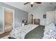 Comfortable bedroom has a neutral color palette, high ceiling, and an ensuite bathroom for added privacy at 419 Equinox Cir, Ladson, SC 29456