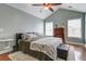 Cozy bedroom features a high ceiling, ample natural light, and neutral tones for a relaxing atmosphere at 419 Equinox Cir, Ladson, SC 29456