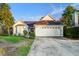 Charming single-story home featuring a well-manicured lawn and attached two-car garage at 419 Equinox Cir, Ladson, SC 29456
