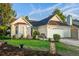 Inviting single story home with manicured landscaping and a cozy bench on the front porch at 419 Equinox Cir, Ladson, SC 29456