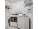 Functional laundry room with white washer, dryer, and shelving at 419 Equinox Cir, Ladson, SC 29456