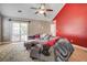 Comfortable living room boasts a neutral color palette, plush seating, and natural light from the sliding glass doors at 419 Equinox Cir, Ladson, SC 29456