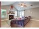 Cozy living room with a fireplace, large sofa, and plenty of natural light at 419 Equinox Cir, Ladson, SC 29456