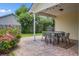 Covered patio with outdoor seating area, stone-like floors, and views of the surrounding yard at 419 Equinox Cir, Ladson, SC 29456