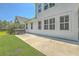 Well-maintained backyard featuring a concrete patio, a hot tub, and manicured green lawn at 420 Oak View Way, Summerville, SC 29483