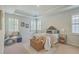 Spacious bedroom with trey ceiling, carpet, and three shuttered windows bringing in natural light at 420 Oak View Way, Summerville, SC 29483