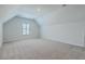 Bright bedroom features neutral walls, plush carpeting, and a window with shutter blinds for natural light at 420 Oak View Way, Summerville, SC 29483