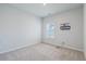 Bedroom with neutral walls, plush carpeting, window with shutter blinds, and a wall mount for a tv at 420 Oak View Way, Summerville, SC 29483