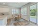 Bright dining area features wood floors, a table with chairs and sliding doors to the outside at 420 Oak View Way, Summerville, SC 29483
