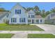 Inviting two-story home with white siding, blue shutters, well-manicured lawn, and a welcoming driveway at 420 Oak View Way, Summerville, SC 29483
