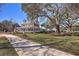Grand two-story home with a covered front porch, mature trees, and a sprawling front yard at 420 Oak View Way, Summerville, SC 29483