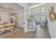 Spacious interior view showcasing an open floor plan with hardwood floors, staircase, dining area and living space at 420 Oak View Way, Summerville, SC 29483