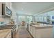 Open concept kitchen features stainless appliances, granite countertops, and a dining area at 420 Oak View Way, Summerville, SC 29483