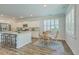 This kitchen and dining area features white cabinets, granite counters, and stainless steel appliances at 420 Oak View Way, Summerville, SC 29483
