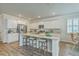Kitchen area showcasing granite countertops, a large island with seating and modern appliances at 420 Oak View Way, Summerville, SC 29483