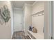 Welcoming mudroom featuring a coat rack, bench with storage, and hardwood floors at 420 Oak View Way, Summerville, SC 29483