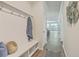 Welcoming mudroom featuring a coat rack, bench with storage, and hardwood floors at 420 Oak View Way, Summerville, SC 29483