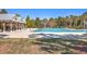 Community pool with palm trees and sunshades, providing a resort-like feel at 420 Oak View Way, Summerville, SC 29483