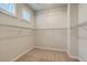 Walk-in closet with carpet, wire shelving, and natural light from two windows with light-filtering shutters at 420 Oak View Way, Summerville, SC 29483