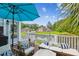 Outdoor living on this spacious back deck with seating and pond views at 5394 Clairmont Ln, North Charleston, SC 29420