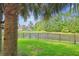 Picturesque backyard with a pond, mature trees, and a view of the home at 5394 Clairmont Ln, North Charleston, SC 29420