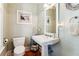 Charming half bathroom with a pedestal sink and classic decor at 5394 Clairmont Ln, North Charleston, SC 29420