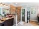 Elegant bathroom with a tiled shower, granite countertops, and neutral tile flooring at 5394 Clairmont Ln, North Charleston, SC 29420
