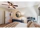 Comfortable bedroom featuring a ceiling fan, round mirror, and natural light at 5394 Clairmont Ln, North Charleston, SC 29420