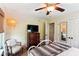 Inviting bedroom featuring natural light, a ceiling fan, and a comfy upholstered chair at 5394 Clairmont Ln, North Charleston, SC 29420