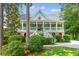 Charming two-story home featuring a welcoming front porch and beautiful landscaped yard at 5394 Clairmont Ln, North Charleston, SC 29420
