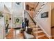 Bright foyer featuring hardwood floors, a staircase, and ample natural light at 5394 Clairmont Ln, North Charleston, SC 29420