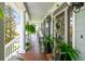 Cozy front porch with potted plants and a view of the neighborhood at 5394 Clairmont Ln, North Charleston, SC 29420