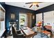 Well-lit home office with modern desk, decor, and a sliding door to the outside at 5394 Clairmont Ln, North Charleston, SC 29420