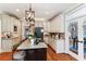 Bright kitchen featuring granite countertops, stainless steel appliances, ample cabinetry and a central island with seating at 5394 Clairmont Ln, North Charleston, SC 29420