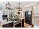 Kitchen with stainless steel appliances, a granite-topped island, and neutral-toned cabinets for a sleek, modern feel at 5394 Clairmont Ln, North Charleston, SC 29420