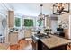 Bright kitchen featuring granite countertops, stainless steel appliances, and a central island with seating at 5394 Clairmont Ln, North Charleston, SC 29420