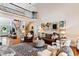 Bright open living area with a soaring ceiling, staircase, and elegant decor, creating a welcoming atmosphere at 5394 Clairmont Ln, North Charleston, SC 29420