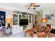 Cozy living room featuring built-in shelving and comfortable seating with a ceiling fan above at 5394 Clairmont Ln, North Charleston, SC 29420