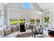 Bright living room showcasing large windows, a comfortable sofa, and hardwood floors at 5394 Clairmont Ln, North Charleston, SC 29420
