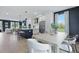 Open concept living area flows into a modern kitchen with island seating, creating a welcoming space at 540 Scholar Way, Summerville, SC 29486