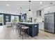 Spacious home shows modern kitchen with stainless steel appliances and opens to a living area with comfortable seating at 540 Scholar Way, Summerville, SC 29486
