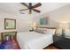 Comfortable bedroom featuring a ceiling fan, closet, bedside tables and lamps, plus stylish decor at 5558 Green Dolphin Way, Kiawah Island, SC 29455