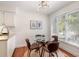Cozy dining area featuring a modern light fixture and a glass-top table with seating for four at 5558 Green Dolphin Way, Kiawah Island, SC 29455
