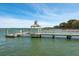 Picturesque waterfront dock featuring boat access, set against a scenic backdrop of calm water and clear sky at 5558 Green Dolphin Way, Kiawah Island, SC 29455