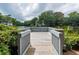Private dock overlooking the water with manicured shrubbery and complex buildings as a scenic backdrop at 5558 Green Dolphin Way, Kiawah Island, SC 29455