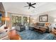 Inviting living room with stylish furnishings, hardwood floors, and sliding glass doors to a patio at 5558 Green Dolphin Way, Kiawah Island, SC 29455