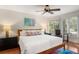 Serene main bedroom with natural light, hardwood floors, and a comfortable queen-sized bed at 5558 Green Dolphin Way, Kiawah Island, SC 29455