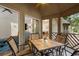 Inviting screened porch with ceiling fan and outdoor seating that offers seamless indoor-outdoor living at 5558 Green Dolphin Way, Kiawah Island, SC 29455