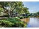 Scenic view of waterway surrounded by lush greenery with the complex's buildings in the distance at 5558 Green Dolphin Way, Kiawah Island, SC 29455